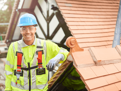 Roofing crew inspecting a residential roof in Georgia